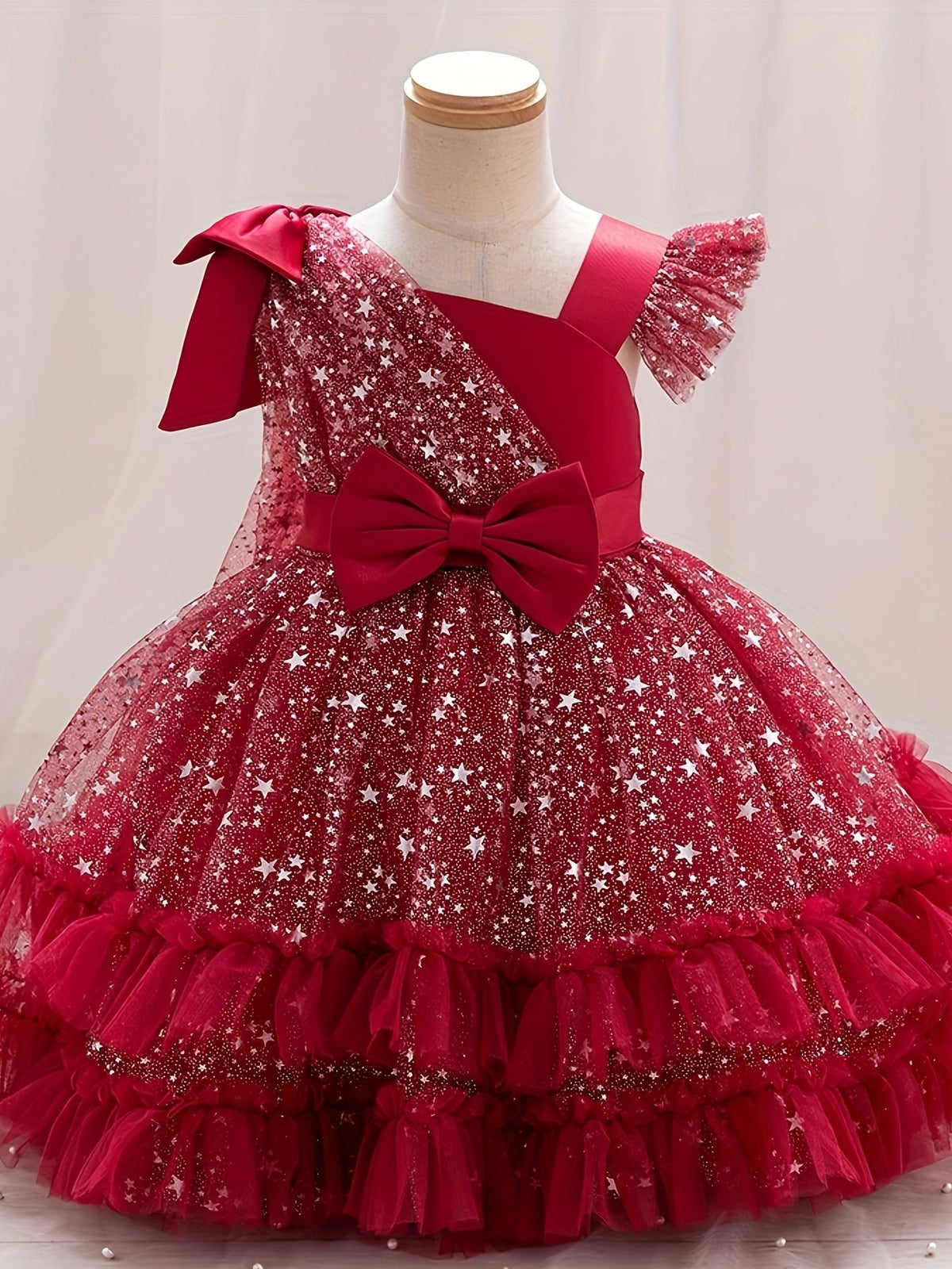 Girls' Star Tulle Party Dress with Large Bow Details and a Tiered Skirt for Birthdays and Celebrations