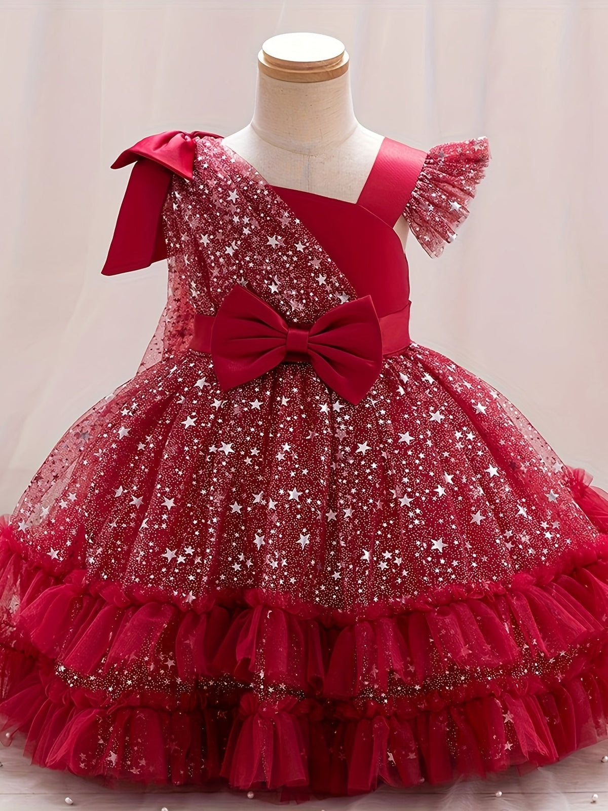 Girls' Star Tulle Party Dress with Large Bow Details and a Tiered Skirt for Birthdays and Celebrations