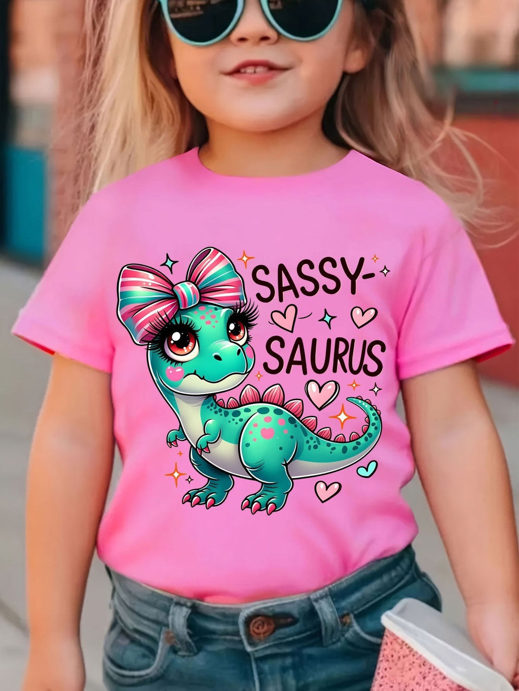 Girls' Sassy Saurus Dinosaur T-Shirt in Rose Red with a Bow Wearing Cartoon Dinosaur and Short Sleeves