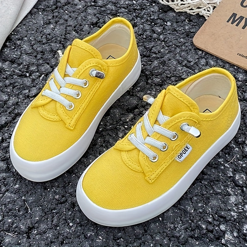 Kids' Low Top Canvas Sneakers with White Laces and Contrast Soles in Black or Red for Casual Outfits